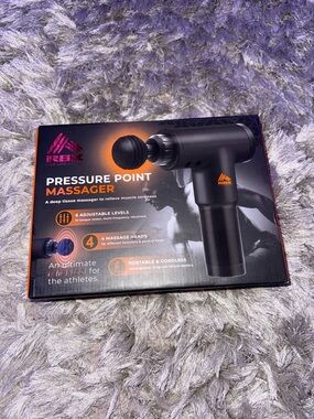 RBX Pressure Point Massager in Black and Orange Packaging